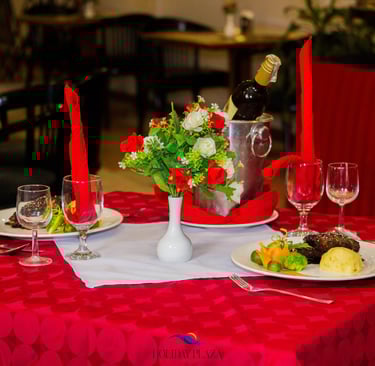 a table with a wine bottle and wine glasses