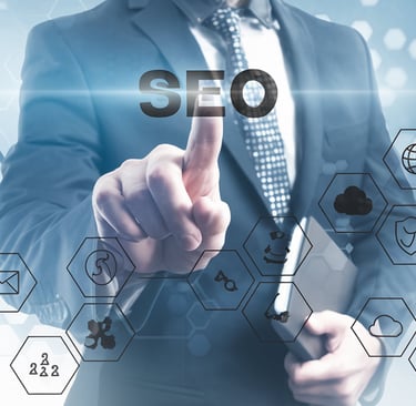 Business owner analyzing SEO reports on laptop for local search visibility
