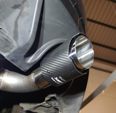 a close up of a car exhaust pipe pipe pipe pipe