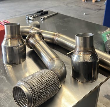 a couple of exhaust pipes on a table