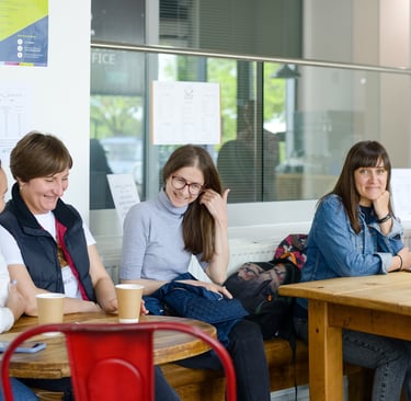 3 ladies laughing and talking