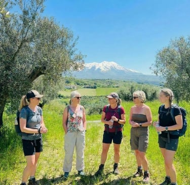 A group of women dressed for a hike in Abruzzo Borgo