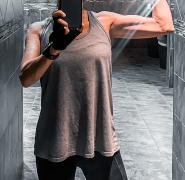 a woman taking a selfie in a mirror in a bathroom