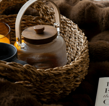 Gentle magnesium wind-down ritual with herbal tea, journal, and candle for bedtime calm