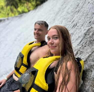 a man and woman in life jackets and life jackets
