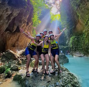 a group of people standing on a rock formation