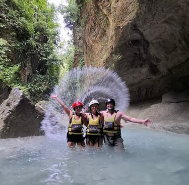 a group of people standing in a river