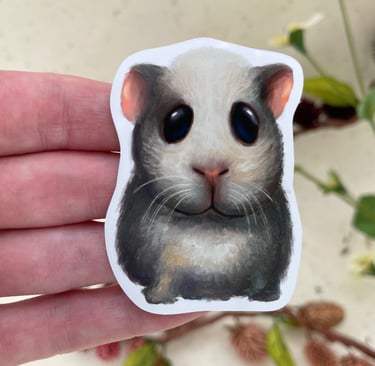 A vinyl sticker of a cute big eyed grey guinea pig 