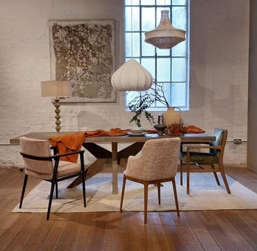 a dining room with a table and chairs