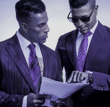 Two businessmen discussing a document