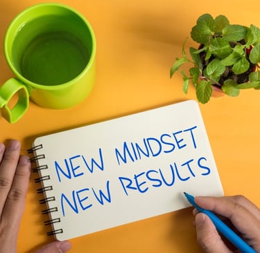 a person writing a new mindset new mindset new mindset new mindset