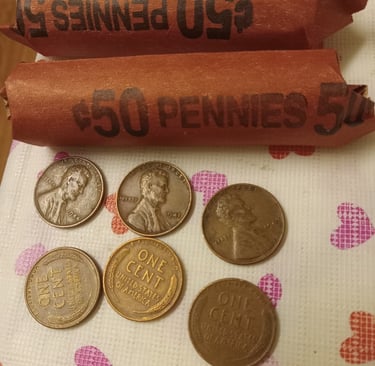 2 rolls of wheat pennies, six wheat pennies 