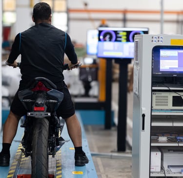 a man riding a motorcycle in a factory