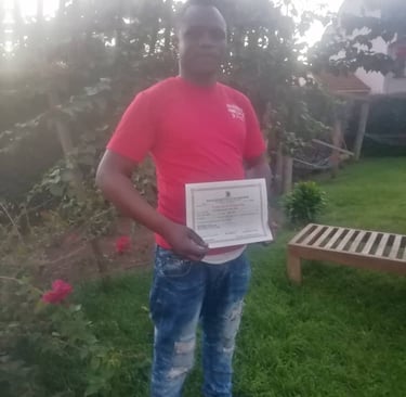 Founder of Rakai Vulnerable Home Center holding a certificate