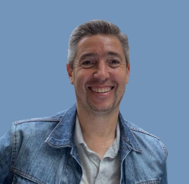a man in a denim jacket and jeans jacket
