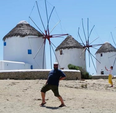 Danny posing in front of the iconic windmills on Mykonos.