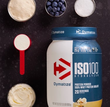 Dymatize ISO100 vanilla whey protein isolate powder with fresh blueberries and smoothie ingredients.