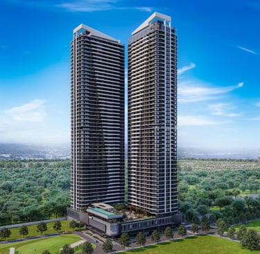 Modern twin luxury skyscraper residential towers overlooking a lush green city park under a blue sky.