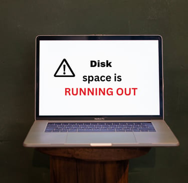 a laptopb screen showing signal on screen that yourdisk space is running out