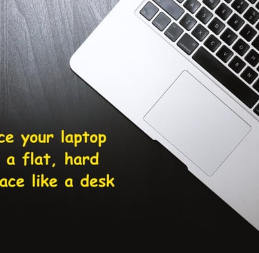 a image showing to place your laptop on a hard flat surface to prevent overheatingg