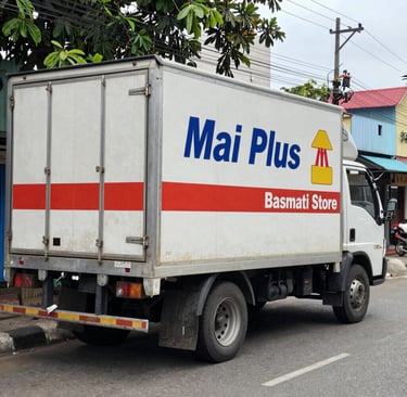 Stacks of Super Grade 1 rice bags ready for bulk delivery to local restaurants.