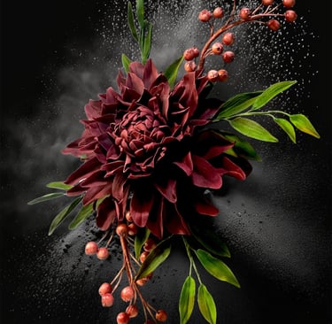a sugar dahlia flower with red berries and green leaves