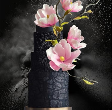 Black wedding cake with pink magnolias 