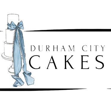 a cake with a blue ribbon tied to a cake logo