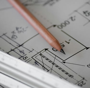 Architect reviewing building drawings during fire safety design development.