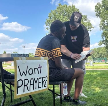 offering prayer in the community park, Taylor, MI