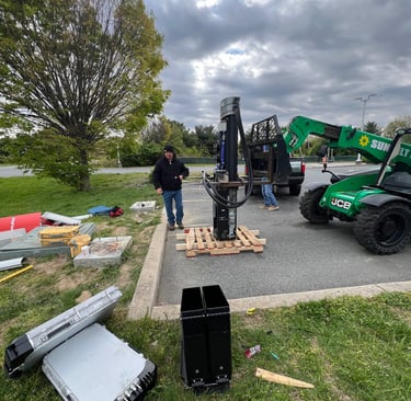 Fixing factory mistake on EV charger pedestals, New Castle, Delaware