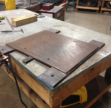 custom 250lb baseplate for wheels to roll a machine around.