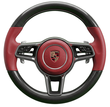 Custom Porsche steering wheel featuring red leather, carbon fiber trim, and multi-function controls.