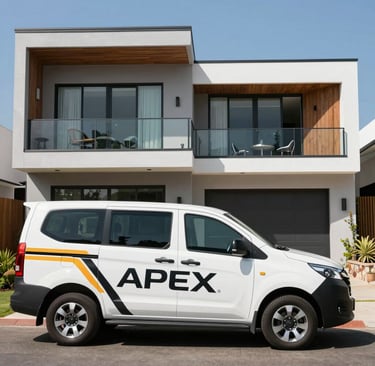 A professional cleaner in navy uniform carefully removing debris from a freshly built industrial site under bright daylight.