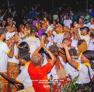 Crowd dancing and celebrating at the Festival Createur Culture Paix in Dassa-Zoume, Benin.