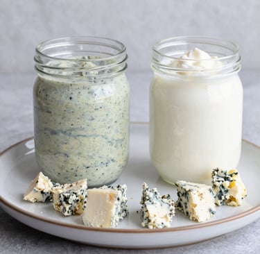 Blue cheese dressing and whole milk plain in yogurt in a jar with Gorgonzola cheese crumbles