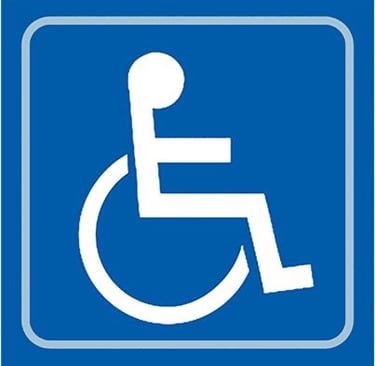 Blue handicapped parking sign featuring the white universal symbol of access for wheelchairs.