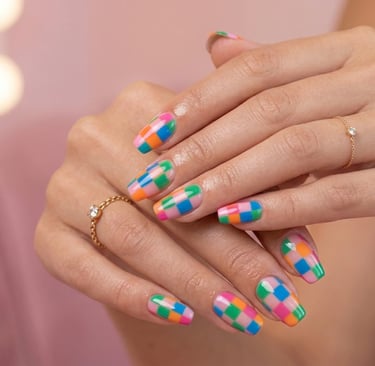 Retro checkerboard colorful nail art with trendy vibrant square patterns on nails