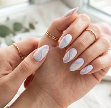 Pastel swirl nail art with pink, lavender, mint green and blue aesthetic patterns