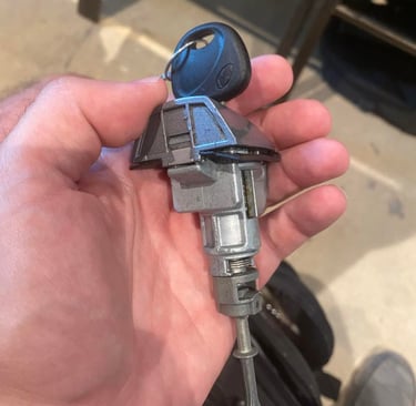 A man holding a key and door lock mechanism for a Hyundai