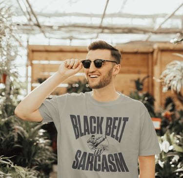 Man wearinf black belt in sarcasm tshirt designed by austistic artist