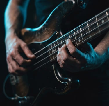Man playing Fender Precision bass guitar lesson