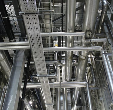 a large metal pipework in a large room