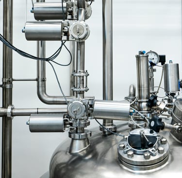 a large metal tank with pipes