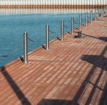a wooden deck with a metal fence