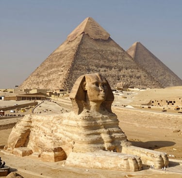 The Great Sphinx of Giza with the Great Pyramid of Khufu in the desert of Egypt.