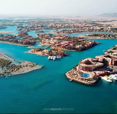 Aerial view of El Gouna Red Sea resort with luxury villas, blue lagoons, and a marina in Egypt.
