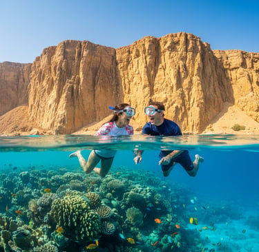 Couple snorkeling over a vibrant coral reef in clear blue tropical water in Sharm El-Sheikh.