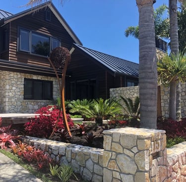 two storye reclad resort style home, natural stone, cedar stained weatherboards, tray style roof