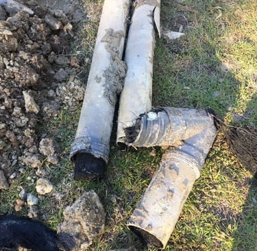Cracked and broken drain pipes removed during repair of damaged sewer system